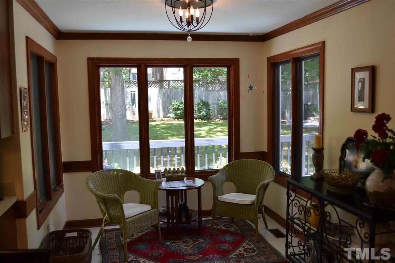 2320 Pastille Lane Raleigh, NC 27612 - Photo 11 of 25 a living room with furniture and a floor to ceiling window