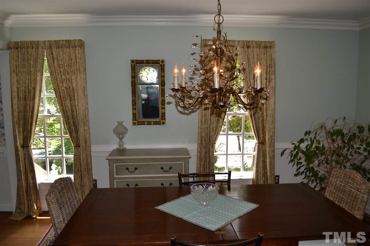 2320 Pastille Lane Raleigh, NC 27612 - Photo 12 of 25 a living room with furniture and a chandelier