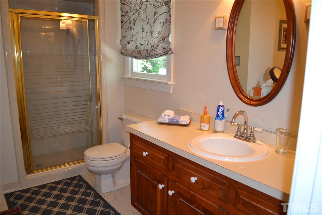 2320 Pastille Lane Raleigh, NC 27612 - Photo 16 of 25 a bathroom with a sink a toilet and a mirror