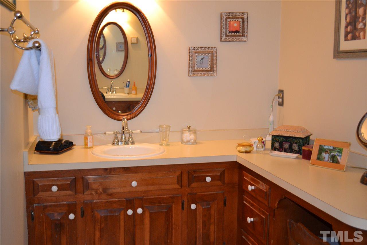 2320 Pastille Lane Raleigh, NC 27612 - Photo 17 of 25 a bathroom with a sink and a mirror