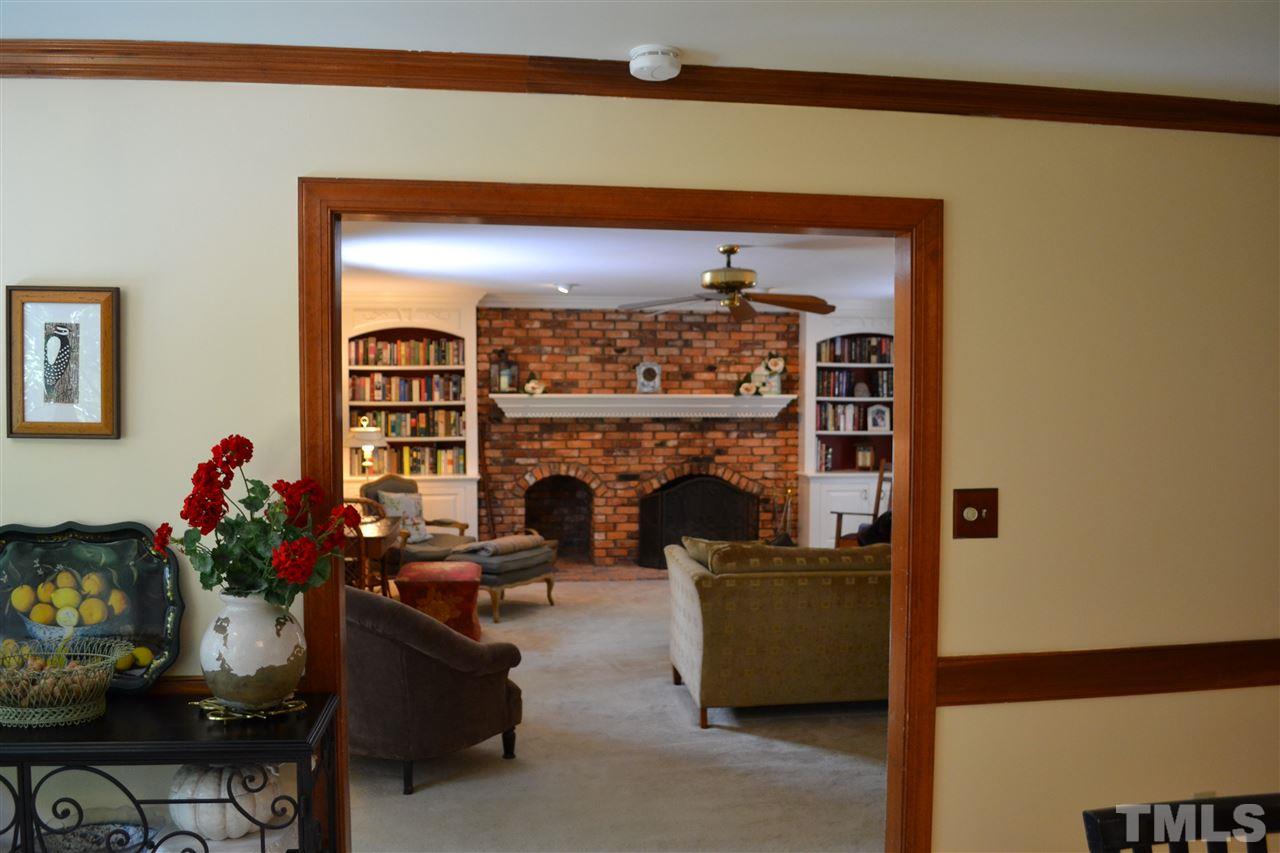2320 Pastille Lane Raleigh, NC 27612 - Photo 6 of 25 a living room with furniture and a fireplace