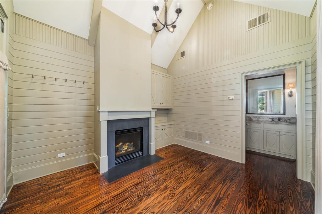 2315 Routh Street Dallas, TX 75201 - Photo 29 of 38 a view of a livingroom with wooden floor and a fireplace