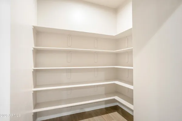 a kitchen with granite countertop white cabinets and stainless steel appliances