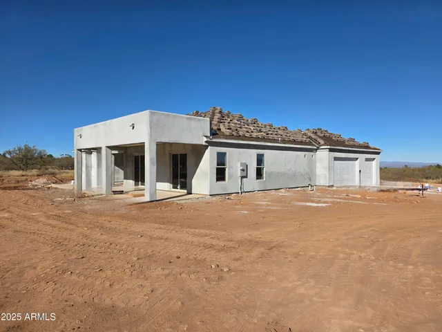 front view of a house with a dry yard