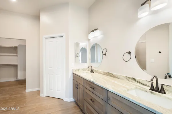a view of a big room with wooden floor and a ceiling fan