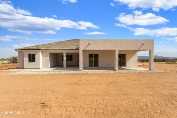 a view of a house with a swimming pool with a yard