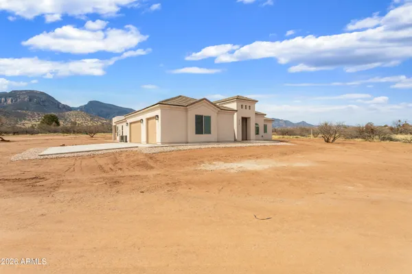 a view of an ocean with a mountain