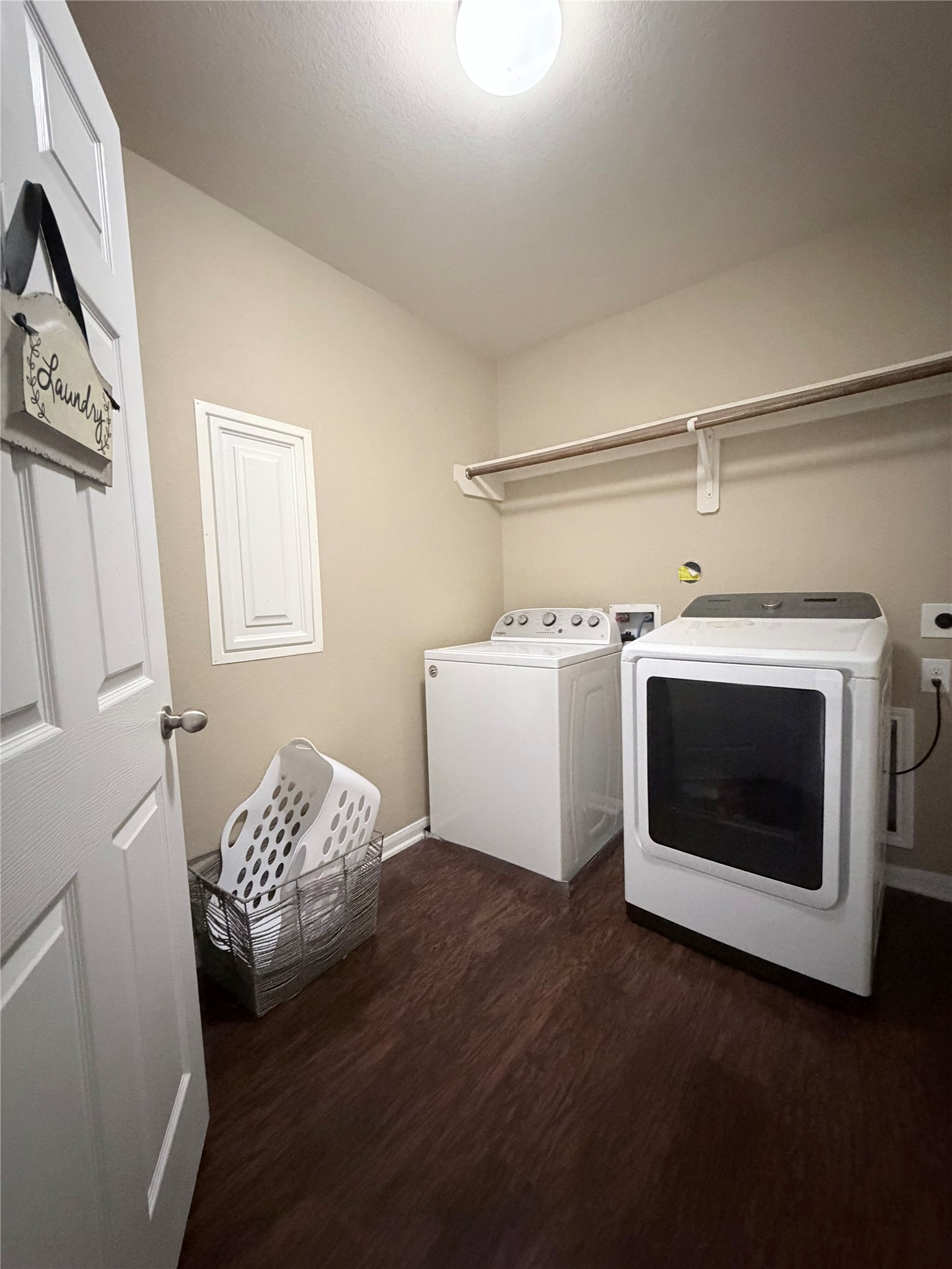 3226 Dappled Vale Trail Spring, TX 77373 - Photo 12 of 26 Huge laundry room with a washer, dryer, wall-mounted shelf, and ample space for organizing laundry essentials.