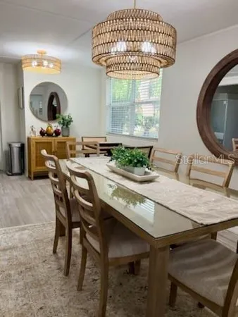 a dining room with furniture and window
