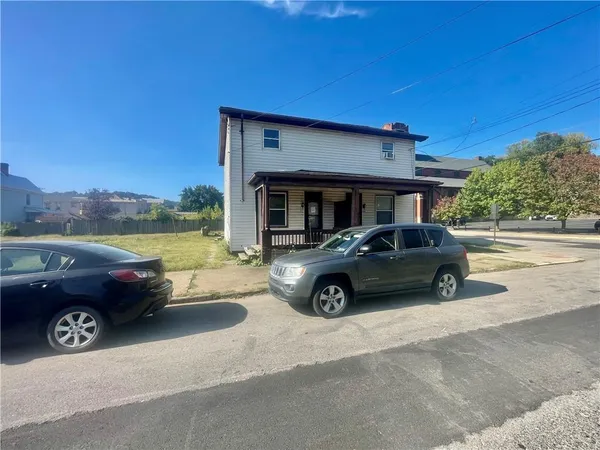 a car parked in front of a house