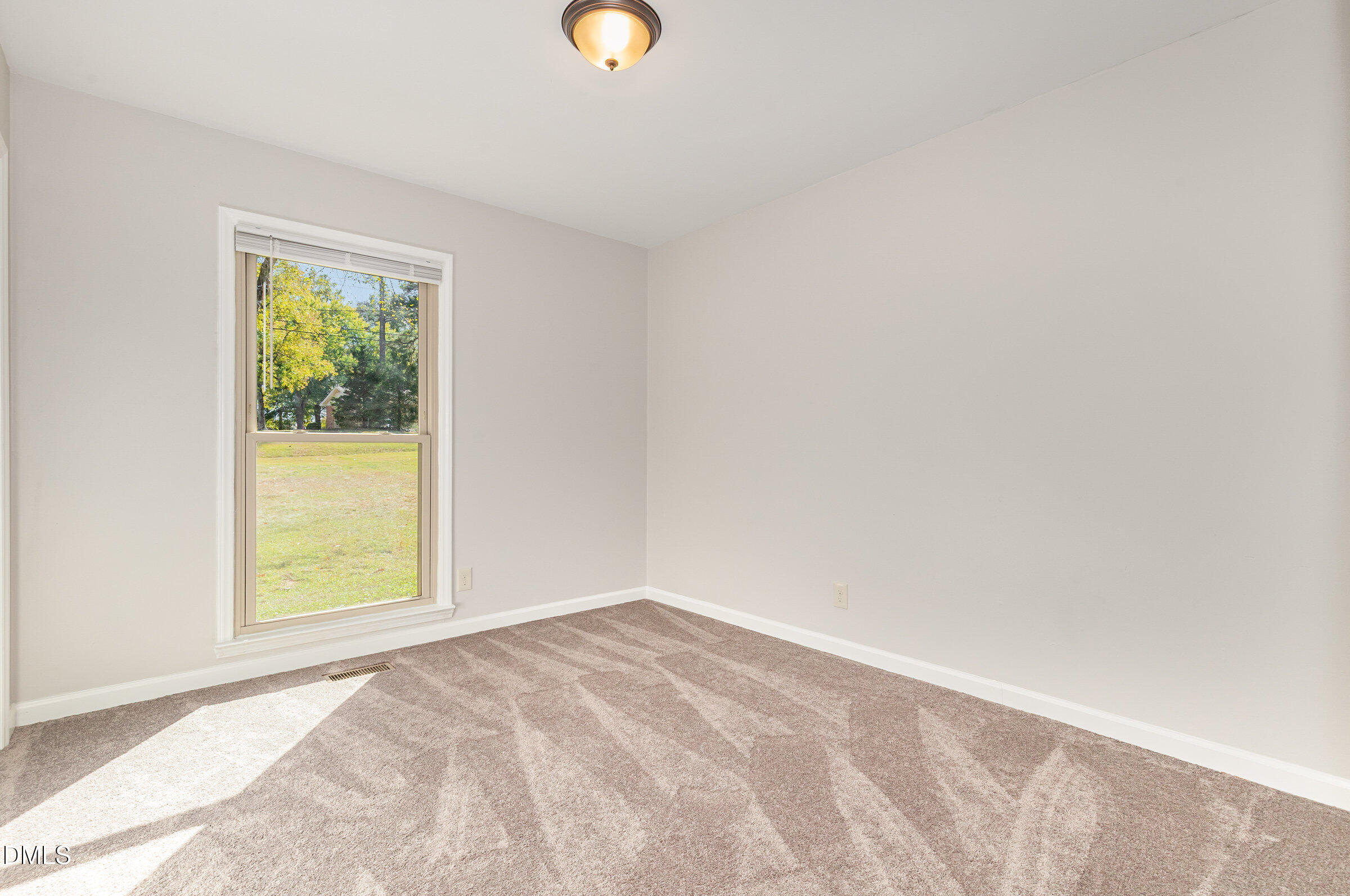 7020 Carpenter Fire Station Road Cary, NC 27519 - Photo 10 of 25 an empty room with a window