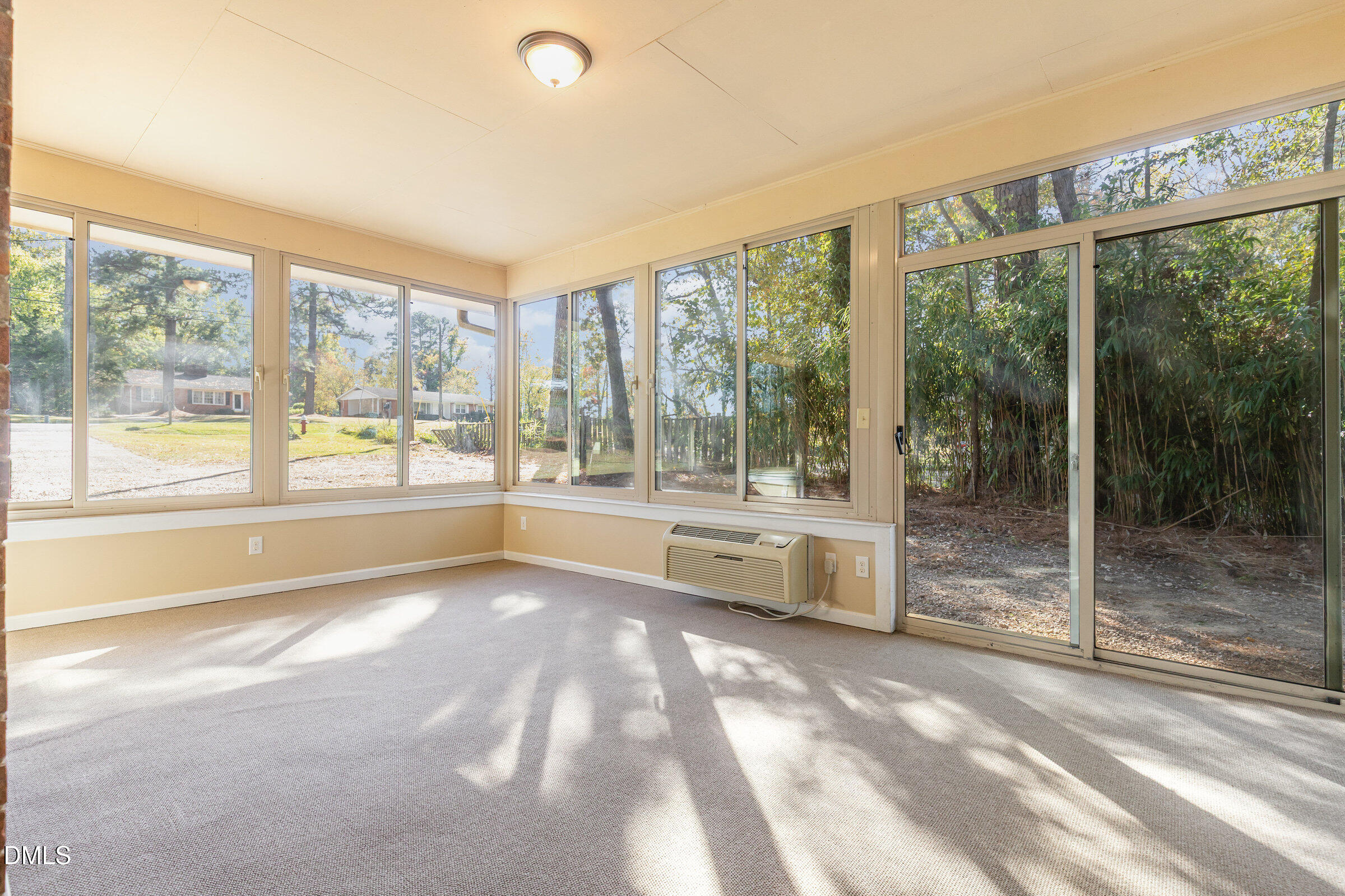 7020 Carpenter Fire Station Road Cary, NC 27519 - Photo 17 of 25 a view of an empty room with wooden floor and a window