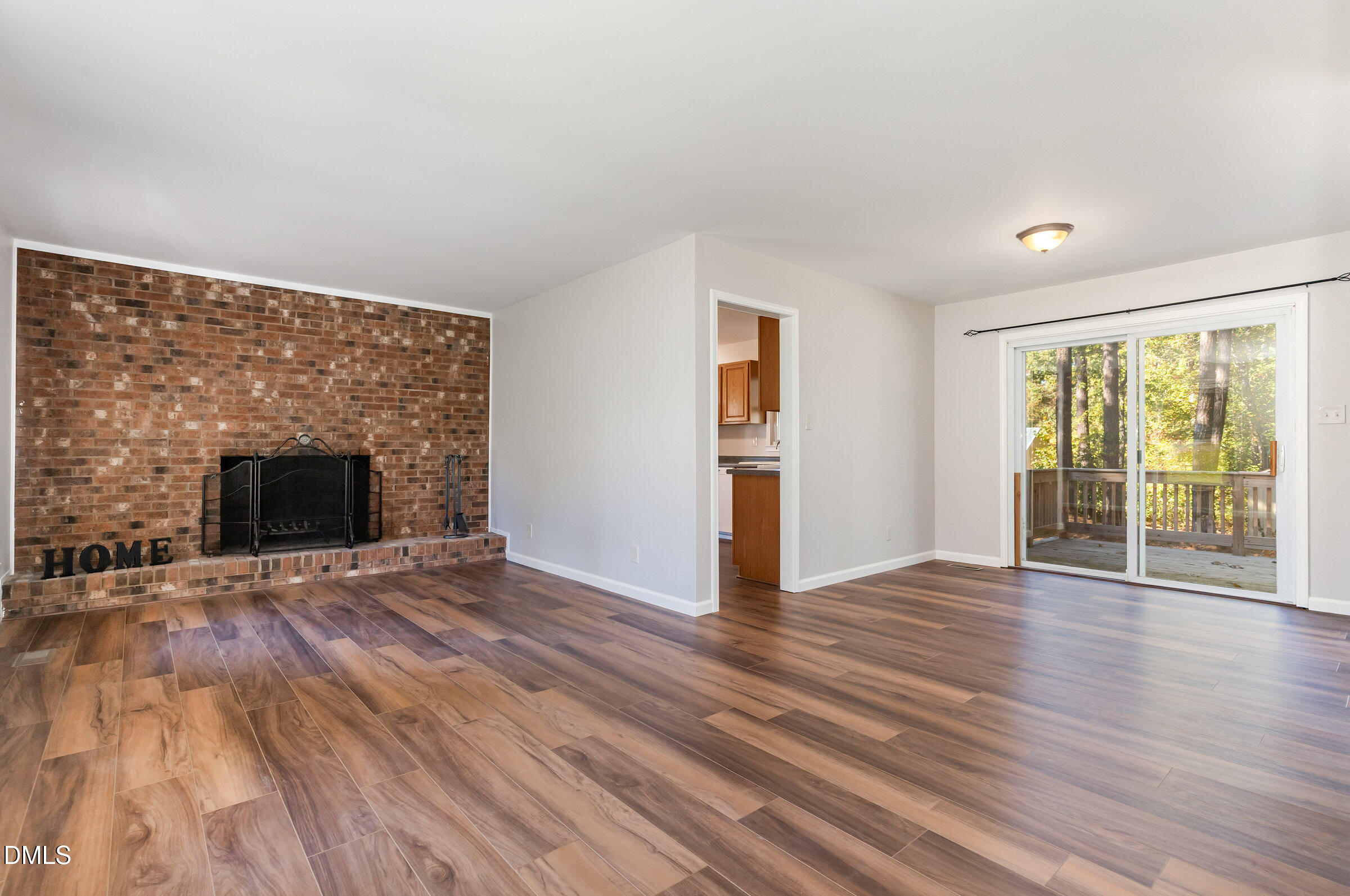 7020 Carpenter Fire Station Road Cary, NC 27519 - Photo 4 of 25 wooden floor fireplace and natural light in room