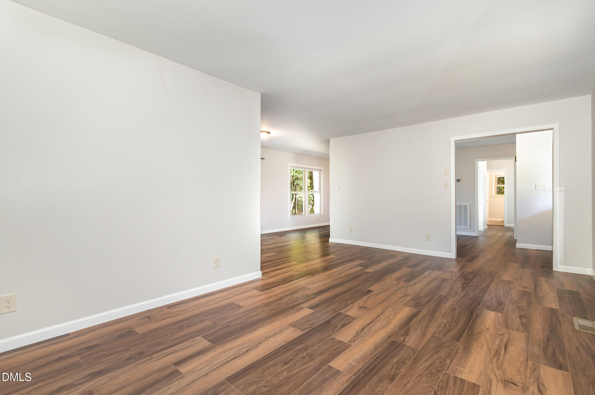 7020 Carpenter Fire Station Road Cary, NC 27519 - Photo 6 of 25 a view of an empty room and wooden floor