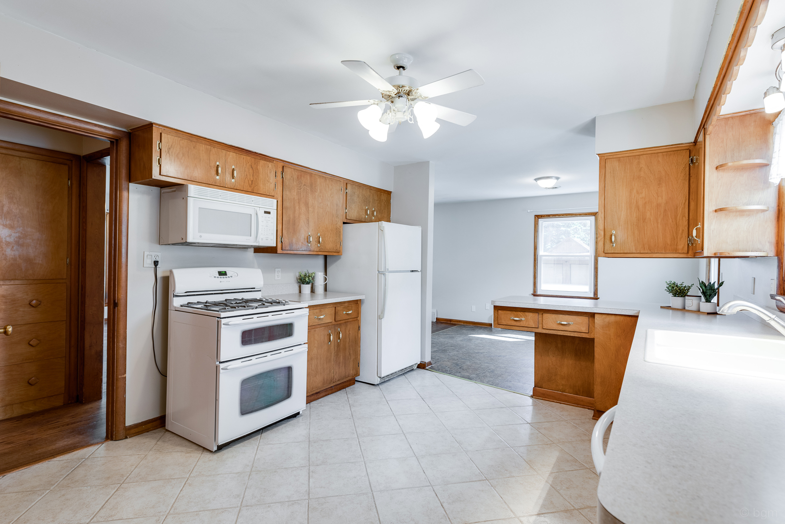 2232 Prairie Street Aurora, IL 60506 - Photo 11 of 28 a kitchen with stainless steel appliances a stove a sink and a refrigerator