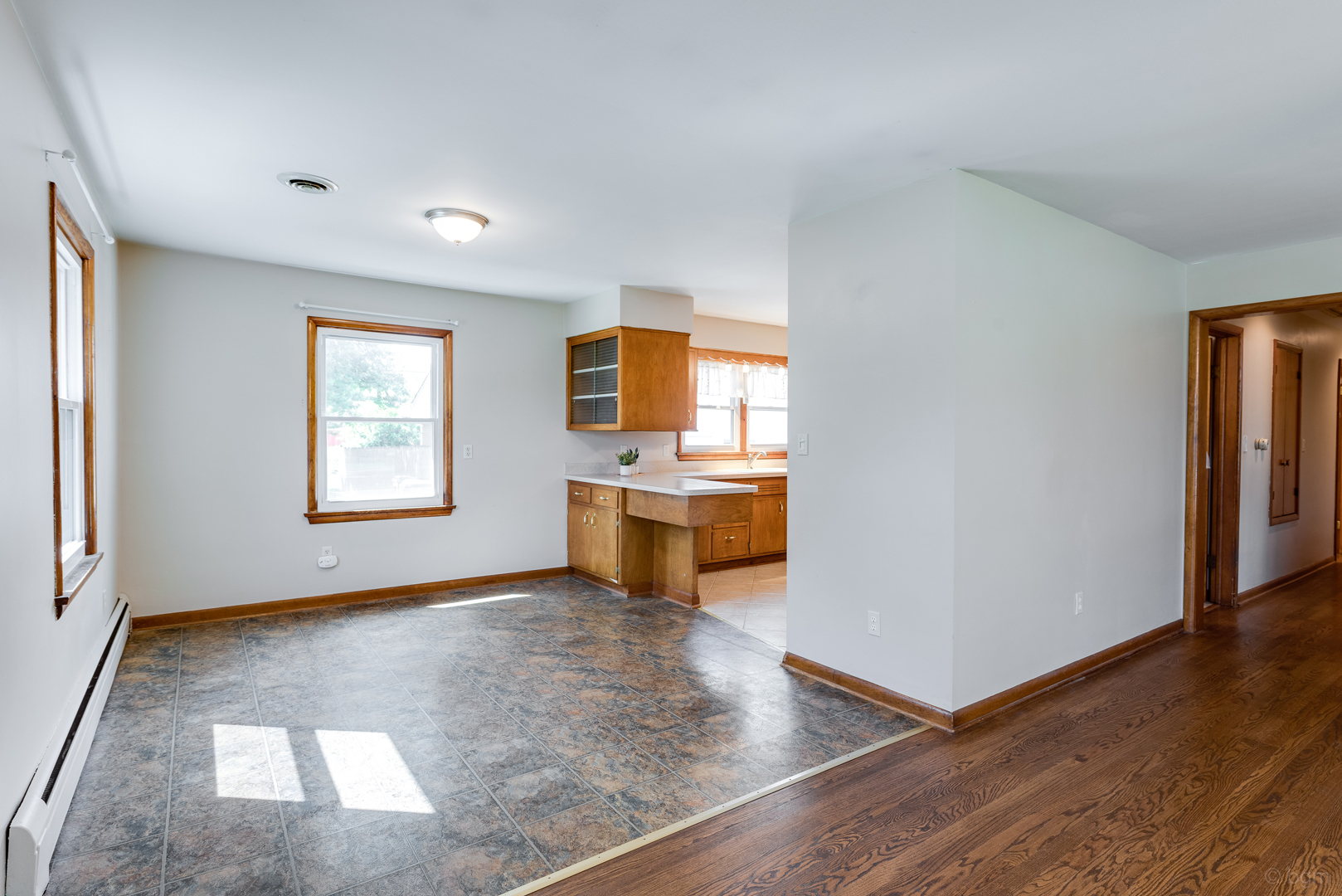 2232 Prairie Street Aurora, IL 60506 - Photo 8 of 28 an empty room with a fireplace and a window