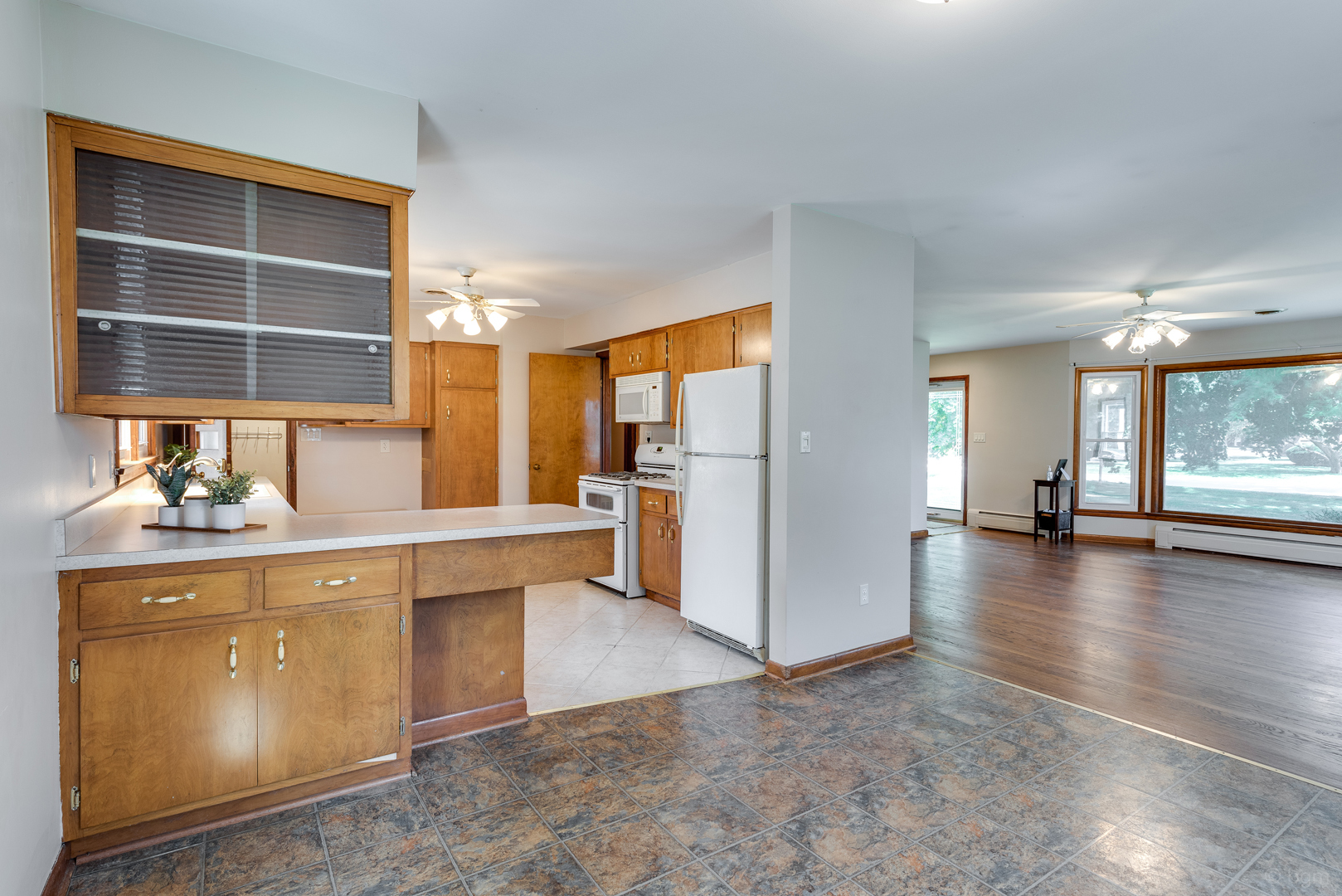 2232 Prairie Street Aurora, IL 60506 - Photo 9 of 28 a kitchen with stainless steel appliances a refrigerator and wooden cabinets