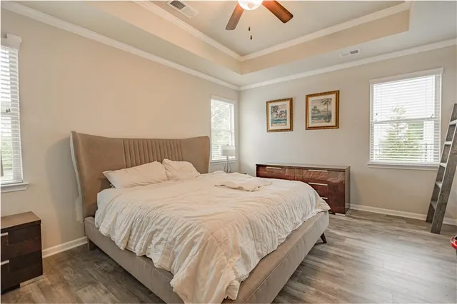 a bedroom with bed and window