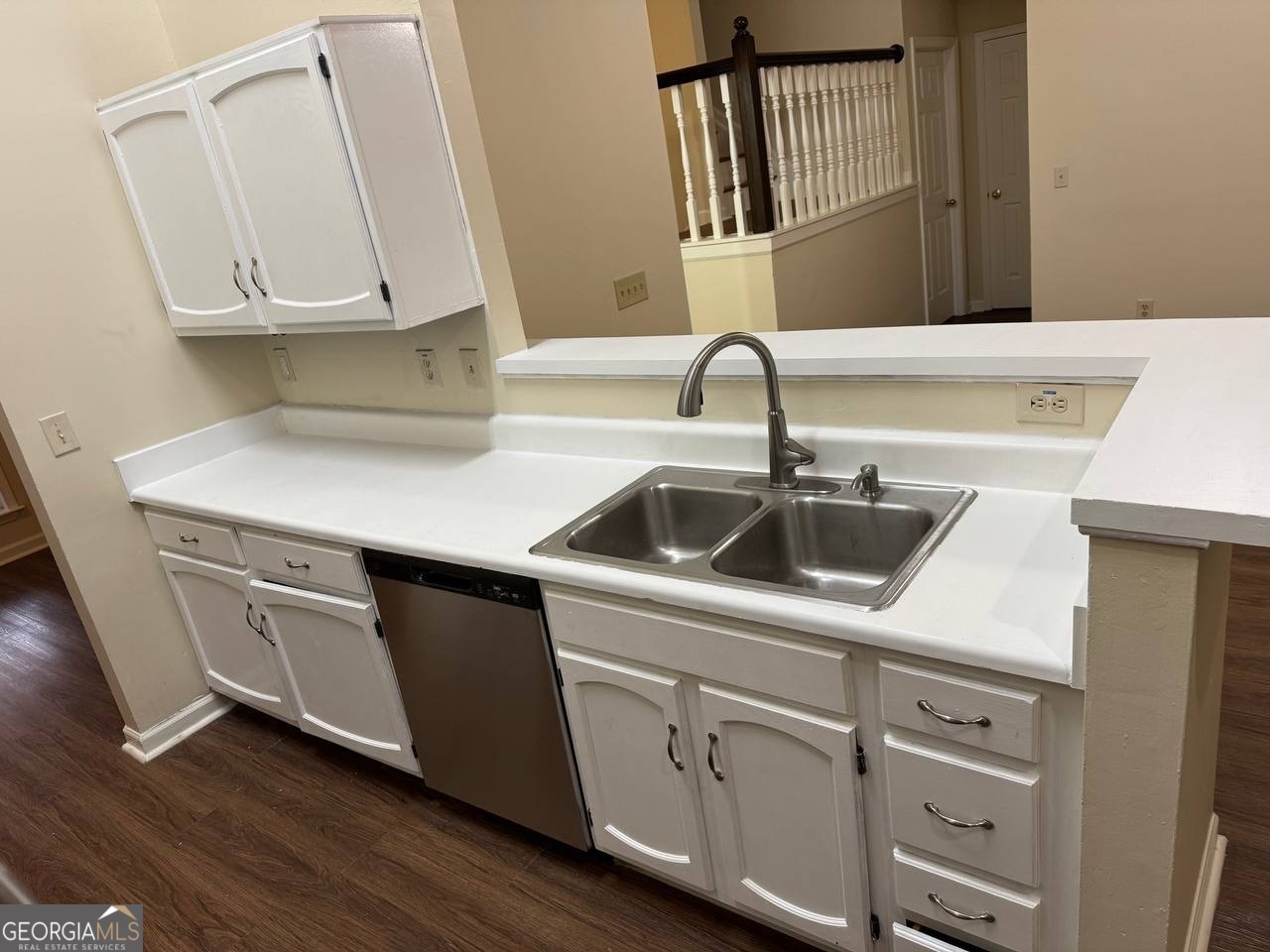 3821 Rex Mill Square Rex, GA 30273 - Photo 30 of 51 a kitchen with a sink cabinets and a wooden floor