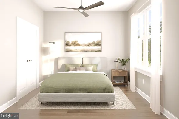 a bedroom with a large bed and a window