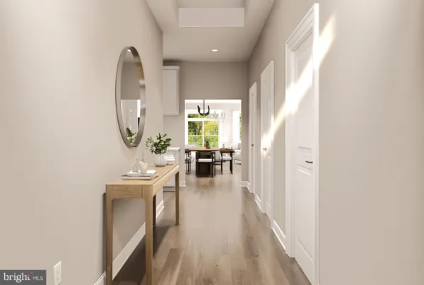 a view of a living room and dining room with wooden floor