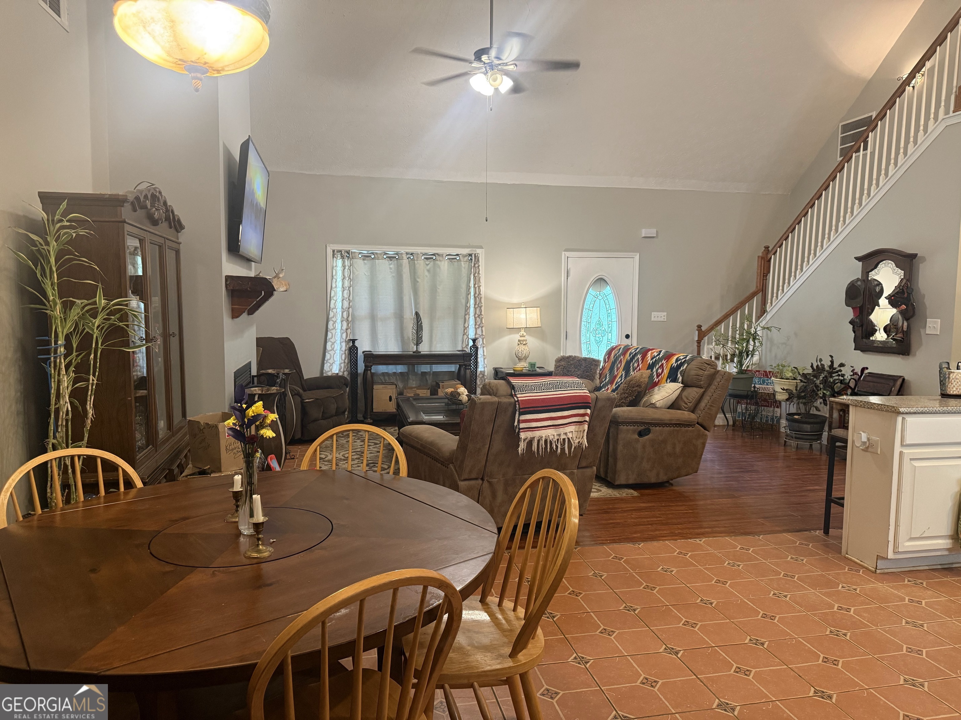 408 Bowen Road Milner, GA 30257 - Photo 13 of 36 a dining room with furniture and a chandelier