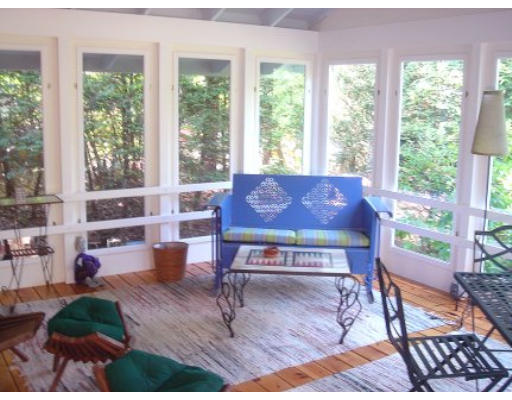 23 Arnold Road Pelham, MA 01002 - Photo 18 of 24 a living room with furniture a rug and a large window