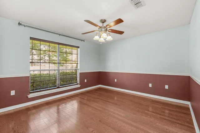 a view of an empty room with a window