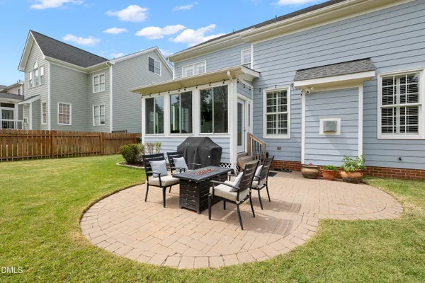 a view of a deck with table and chairs and wooden floor
