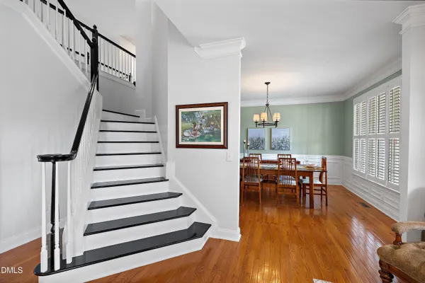a view of a livingroom with furniture hardwood floor and a window
