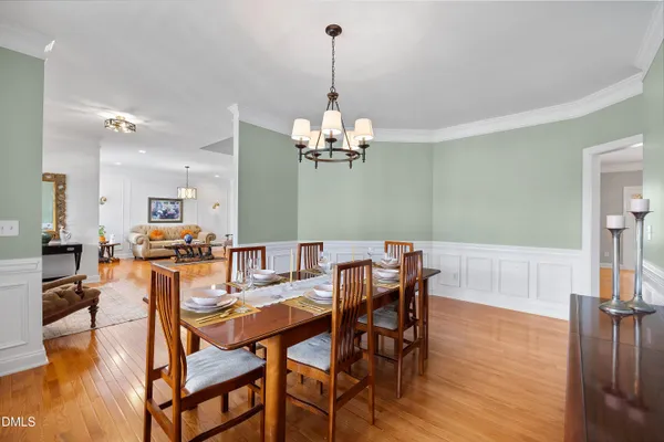 a kitchen with stainless steel appliances granite countertop a sink refrigerator and cabinets