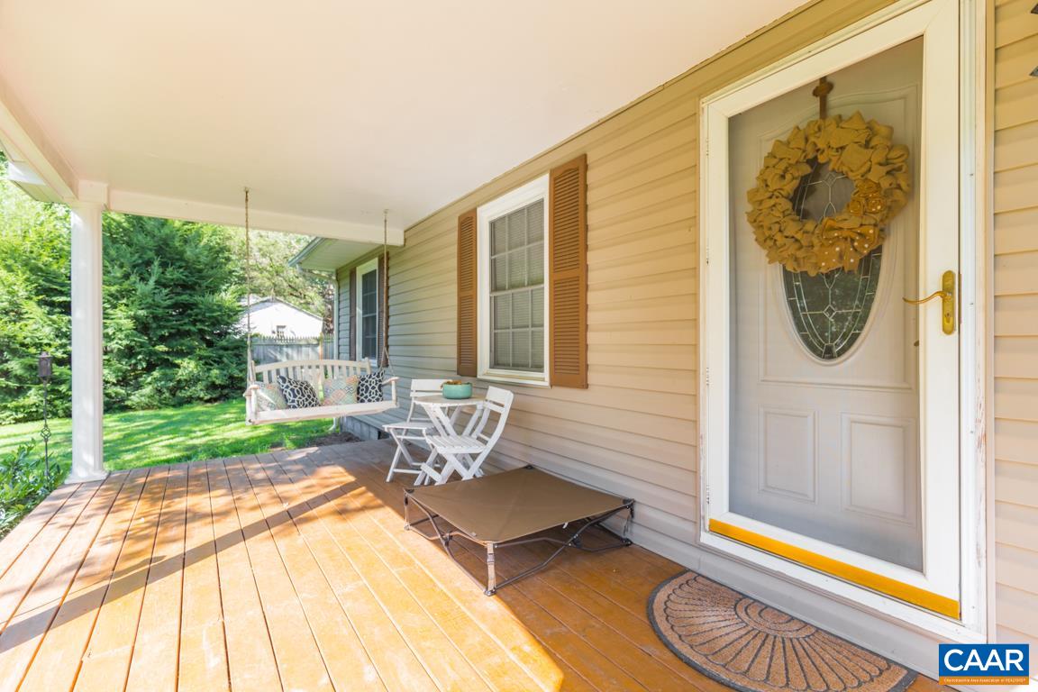 167 Westview Road Ruckersville, VA 22968 - Photo 3 of 50 a living room with a bed and a table