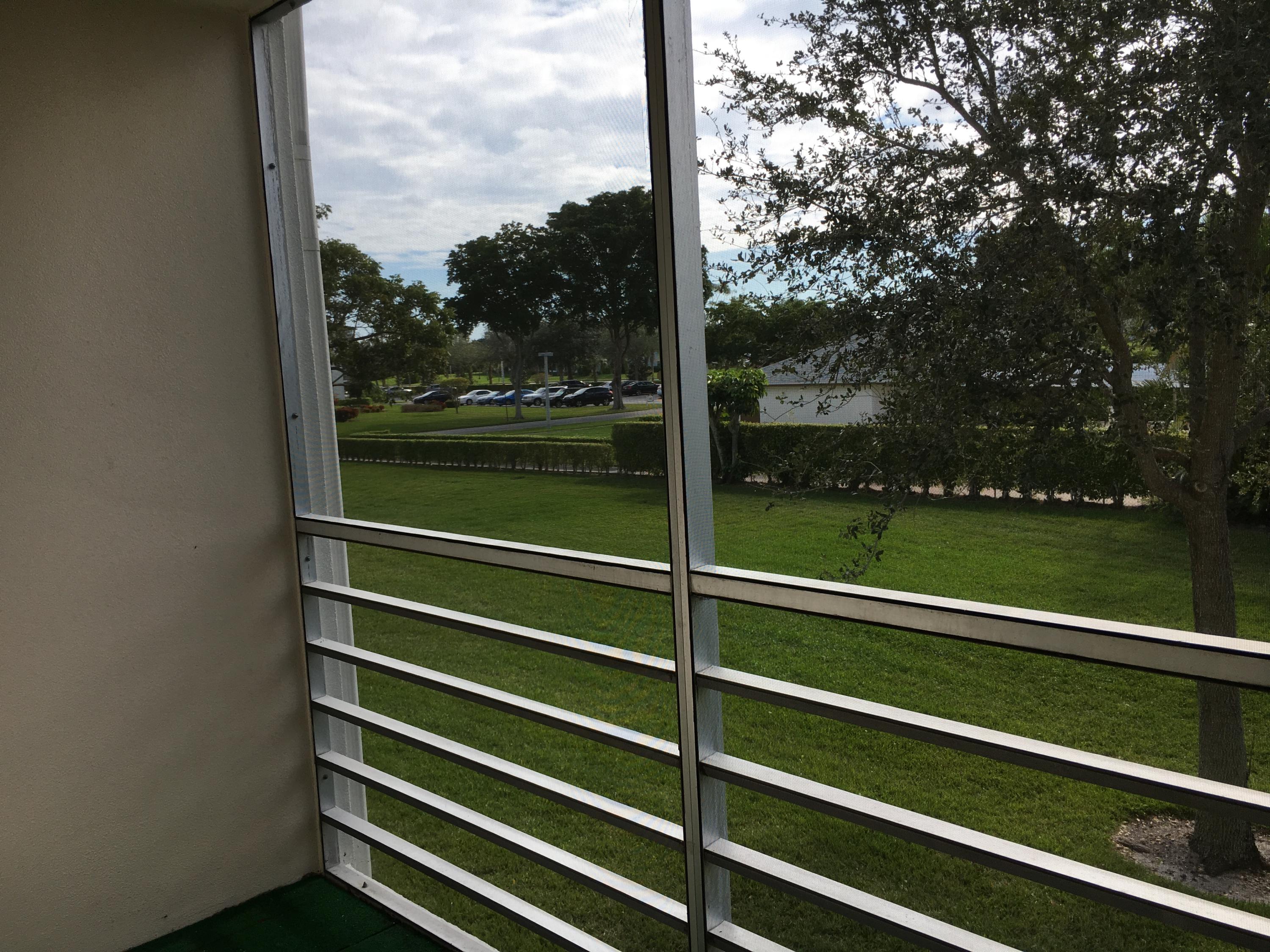 189 Mansfield East, Unit 189 Boca Raton, FL 33434 - Photo 9 of 10 Screened Patio with Pool view