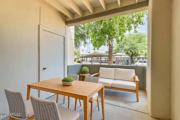 a view of a dining room with furniture window and outside view
