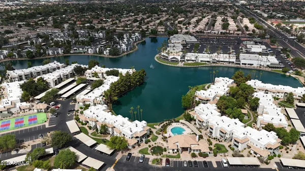 an aerial view of a house with a lake view