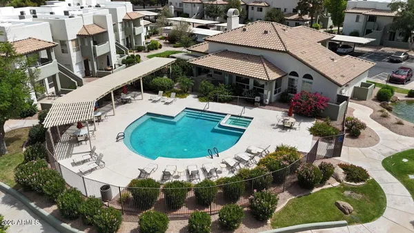 an aerial view of a house with outdoor space