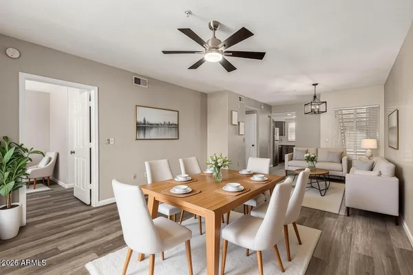 a view of a dining room with furniture and wooden floor