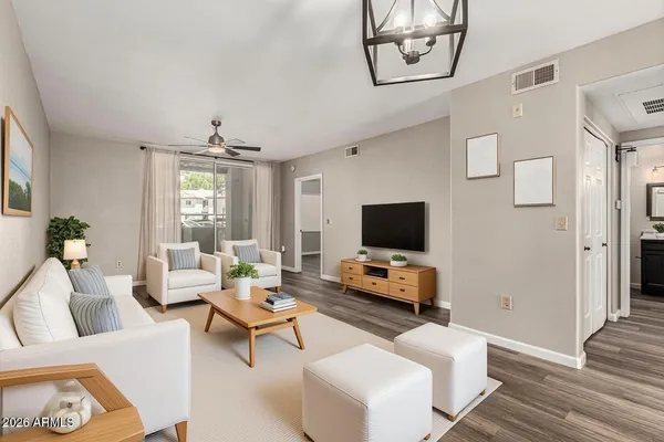 a living room with furniture and a flat screen tv