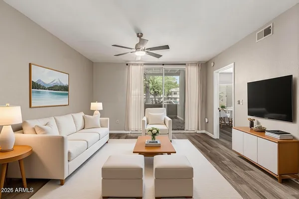 a living room with furniture and a flat screen tv