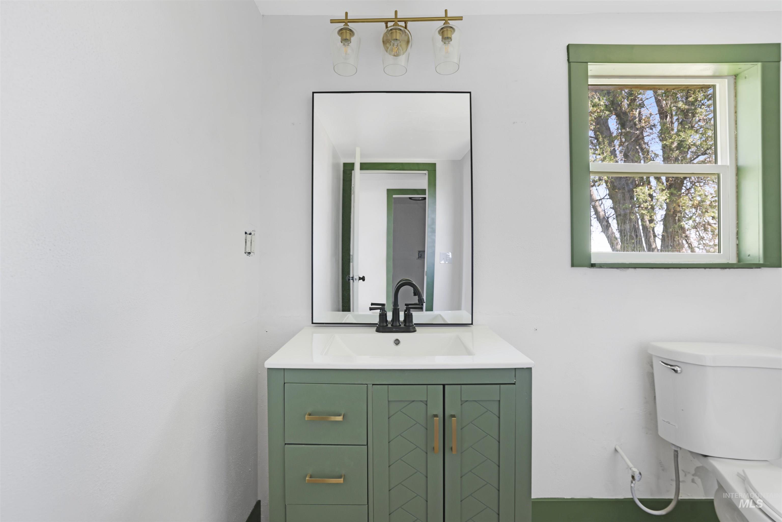 102 South 400 West Rupert, ID 83350 - Photo 15 of 15 Bathroom with toilet and vanity