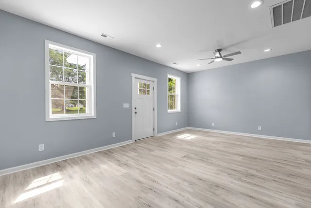 a view of an empty room with a window