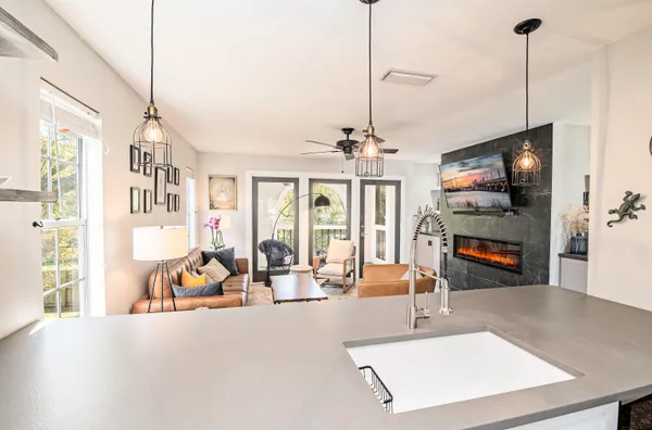 a view of a living room and kitchen floor