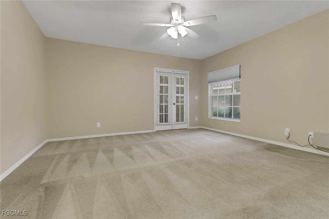 100 Siena Way, Unit 1201 Naples, FL 34119 - Photo 11 of 25 a view of an empty room with a window