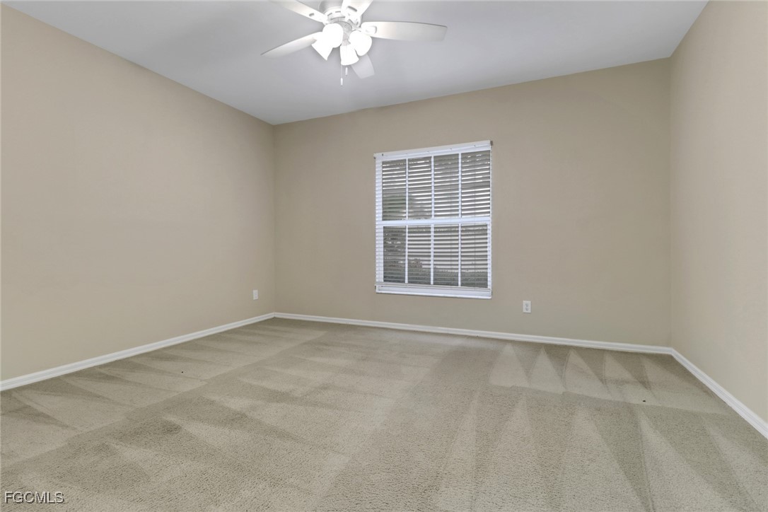 100 Siena Way, Unit 1201 Naples, FL 34119 - Photo 16 of 25 an empty room with windows