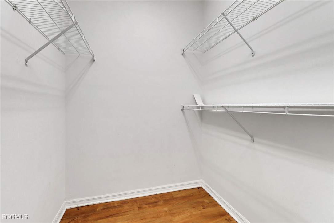 100 Siena Way, Unit 1201 Naples, FL 34119 - Photo 18 of 25 a view of a room with racks on the wall