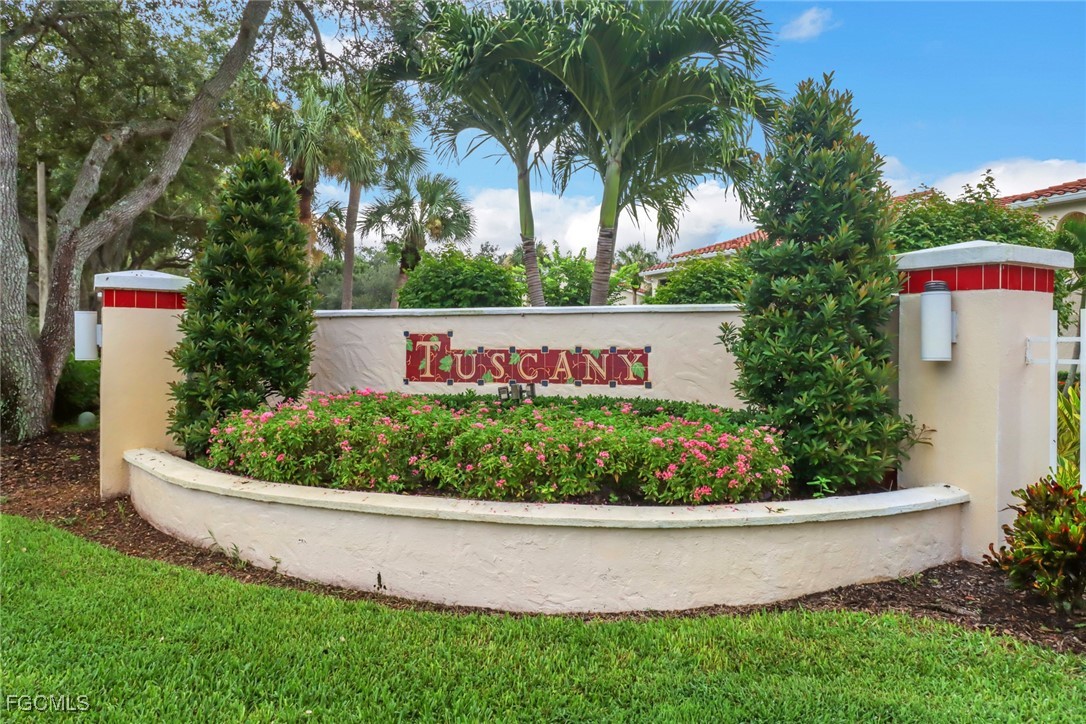 100 Siena Way, Unit 1201 Naples, FL 34119 - Photo 22 of 25 a view of a house with a yard and potted plants