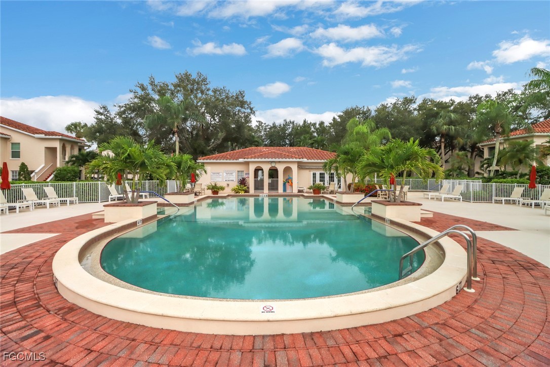 100 Siena Way, Unit 1201 Naples, FL 34119 - Photo 25 of 25 a view of outdoor space yard swimming pool and outdoor