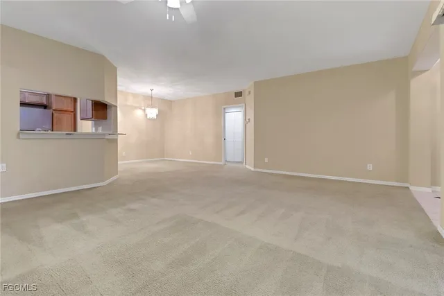 a view of a big room with windows and cabinet
