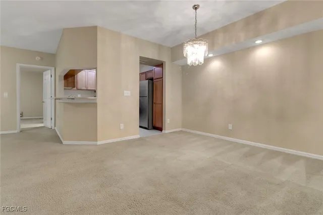 a view of a room with a furniture and chandelier