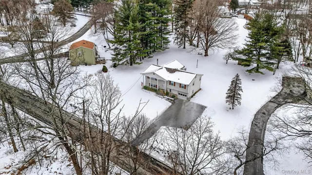 an aerial view of a house with outdoor space